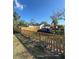 Home exterior featuring a newly constructed wooden fence, landscaping and a private driveway at 3623 N 53Rd St, Tampa, FL 33619