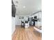 Bright kitchen with white cabinetry, granite counters, and island seating at 3623 N 53Rd St, Tampa, FL 33619