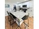 Bright kitchen with white cabinets, stainless steel appliances, and a large island with bar seating at 3623 N 53Rd St, Tampa, FL 33619