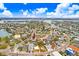 Sweeping aerial view of waterfront community, showcasing a vibrant coastal neighborhood with stunning water views at 411 Virginia Ave, Madeira Beach, FL 33708