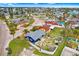 Beautiful aerial shot of the home, showcasing its landscaped yard and quiet neighborhood streets at 411 Virginia Ave, Madeira Beach, FL 33708