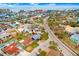 Wonderful aerial view of community near a beach, highlighting the property's desirable location and neighborhood charm at 411 Virginia Ave, Madeira Beach, FL 33708