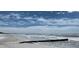 Relaxing beach view with white sand and clear blue skies on a sunny day at 411 Virginia Ave, Madeira Beach, FL 33708