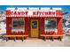 Charming Candy Kitchen building, painted with a cheerful red and white awning at 411 Virginia Ave, Madeira Beach, FL 33708