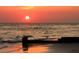 Amazing sunset view reflecting off the water with rich hues of orange, pink and yellow at 411 Virginia Ave, Madeira Beach, FL 33708