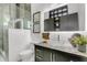 Contemporary bathroom with a glass bowl sink, unique backsplash, and a view of the sleek shower area at 4156 Gauge Line Loop, Tampa, FL 33624