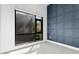Serene bedroom features a large window and a textured accent wall adding visual interest at 4156 Gauge Line Loop, Tampa, FL 33624