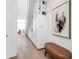 Hallway featuring hardwood floors and custom built-in storage at 4156 Gauge Line Loop, Tampa, FL 33624