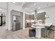 Open concept kitchen with stainless steel appliances, grey cabinets, and peninsula seating at 4156 Gauge Line Loop, Tampa, FL 33624