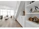 Bright living room featuring custom built-in storage and views of the outdoors at 4156 Gauge Line Loop, Tampa, FL 33624