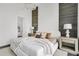 Comfortable bedroom with unique accent walls, plush bedding, stylish lamps, and a bright, airy feel at 4156 Gauge Line Loop, Tampa, FL 33624