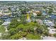 Aerial view of canal-front homes nestled among mature trees at 4266 Marine Pkwy, New Port Richey, FL 34652