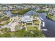 Aerial shot of a waterfront property surrounded by canals, docks, and lush landscaping at 4266 Marine Pkwy, New Port Richey, FL 34652