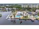 Overhead view of a waterfront property featuring a private pool and boat docks at 4266 Marine Pkwy, New Port Richey, FL 34652