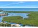 Scenic aerial shot of waterfront homes with mangrove islands and expansive views of the sea at 4266 Marine Pkwy, New Port Richey, FL 34652