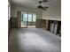 Large living room with floor to ceiling block walls and access to patio, ideal for remodeling and making your own at 4266 Marine Pkwy, New Port Richey, FL 34652