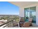 Relaxing balcony with comfortable seating and stunning views of the water and cityscape at 450 Knights Run Ave # 1704, Tampa, FL 33602