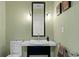 Modern powder room with a vessel sink, black vanity, and modern fixtures at 450 Knights Run Ave # 1704, Tampa, FL 33602
