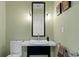 Stylish powder room featuring a vessel sink, modern fixtures, and elegant wall decor at 450 Knights Run Ave # 1704, Tampa, FL 33602