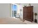 Bedroom featuring a closet, floor lamp, chair, and balcony with a view of the city at 450 Knights Run Ave # 1704, Tampa, FL 33602