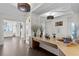 Beautifully decorated hallway with a mirrored wall, console table and modern lighting fixtures at 450 Knights Run Ave # 1704, Tampa, FL 33602