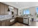 Well-equipped kitchen with granite countertops, stainless steel appliances and a scenic view at 450 Knights Run Ave # 1704, Tampa, FL 33602