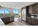 Kitchen area with stainless steel appliances, dark cabinets and a beautiful water view at 450 Knights Run Ave # 1704, Tampa, FL 33602