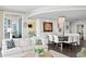 Bright, airy living room with modern decor, and a view into the dining and kitchen areas at 450 Knights Run Ave # 1704, Tampa, FL 33602