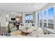 A bright living room with an open floor plan and floor-to-ceiling windows with water views at 450 Knights Run Ave # 1704, Tampa, FL 33602