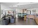 Open-concept living area with a kitchen bar, dining area and comfortable seating at 450 Knights Run Ave # 1704, Tampa, FL 33602