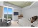 Bright main bedroom with a sitting area, private balcony and scenic water views at 450 Knights Run Ave # 1704, Tampa, FL 33602