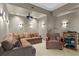 Theater room features projector, sconces, comfortable seating, and media storage at 450 Knights Run Ave # 1704, Tampa, FL 33602