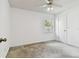 Simple bedroom with carpet, a ceiling fan and a window providing natural light at 4735 Foxshire Cir, Tampa, FL 33624