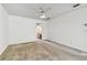 Bedroom features neutral carpet, ceiling fan, and en-suite bathroom with a pink vanity at 4735 Foxshire Cir, Tampa, FL 33624