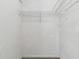 Small closet with white walls and wire shelving for organization and storage at 4735 Foxshire Cir, Tampa, FL 33624
