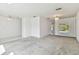 Bright living room featuring neutral carpet, tile entryway, and bright white walls at 4735 Foxshire Cir, Tampa, FL 33624