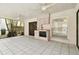 Covered patio area featuring an outdoor kitchen, ceiling fans, and tile flooring at 4735 Foxshire Cir, Tampa, FL 33624