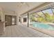 Inviting pool and screened-in lanai featuring an outdoor kitchen for seamless indoor-outdoor living at 4735 Foxshire Cir, Tampa, FL 33624