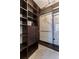 Spacious walk-in closet with wood shelving and drawers at 4739 Silverking Way, Palm Harbor, FL 34684