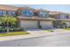 Inviting townhouse with a two-car garage, mature landscaping, and a well-maintained lawn in a desirable neighborhood at 4739 Silverking Way, Palm Harbor, FL 34684