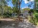 Spacious backyard featuring mature landscaping and outdoor patio at 8480 Colma St, Spring Hill, FL 34606