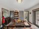 Comfortable home office with warm colors, built-in shelving, and natural light from the window at 8480 Colma St, Spring Hill, FL 34606