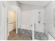 Modern bathroom featuring a soaking tub with tiled accents and accessible features at 8941 Southbay Dr, Tampa, FL 33615