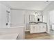 Bright bathroom with dual sinks, granite countertops, and a luxurious walk-in shower at 8941 Southbay Dr, Tampa, FL 33615