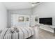 Bright bedroom with a pool view, featuring a comfortable bed and plenty of natural light at 8941 Southbay Dr, Tampa, FL 33615