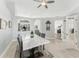 Bright dining room featuring elegant decor, wood floors, and open access to the kitchen and living areas at 8941 Southbay Dr, Tampa, FL 33615