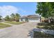 Beautiful home with a well-manicured lawn and spacious driveway leading to a two-car garage at 8941 Southbay Dr, Tampa, FL 33615