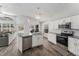 Bright, renovated kitchen with stainless appliances, a large island, and seamless flow to living spaces and backyard views at 8941 Southbay Dr, Tampa, FL 33615