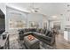 Spacious living room featuring a large sectional sofa, vaulted ceiling, and ample natural light at 8941 Southbay Dr, Tampa, FL 33615