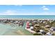 Aerial view of the waterfront home, canal, and beach at 9696 Little Gasparilla Isand, Placida, FL 33946